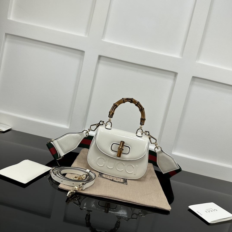 G*u*i top handle bags